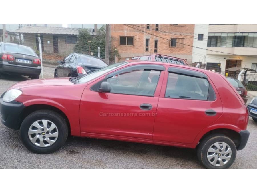 CHEVROLET - CELTA - 2009/2010 - Vermelha - R$ 21.900,00